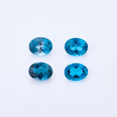 Parcel of 4 x Oval Mixed cut, Loose London Blue Topaz, Total weight 8.24cts