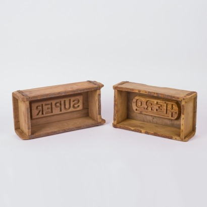 A Pair of 'Super Hero' Wood Brick Moulds