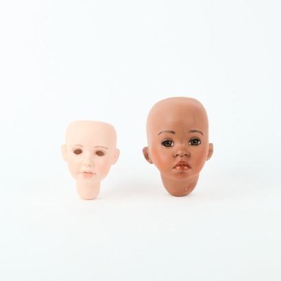 A Pair Of Porcelain Doll Heads