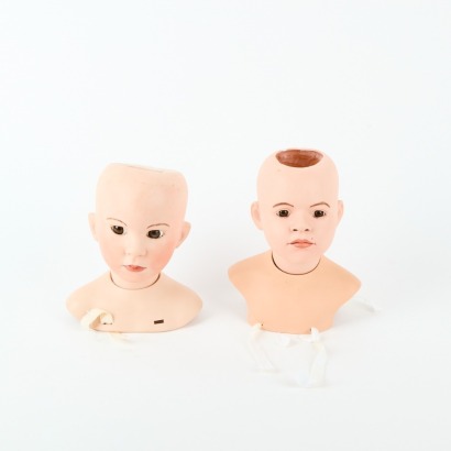A Pair Of Porcelain Doll Busts