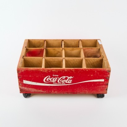 A Vintage Coca Cola Crate On Castors