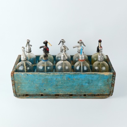 A Vintage Soda Crate With Ten Bottles