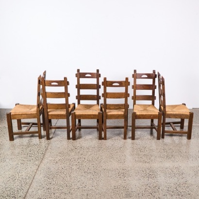 A Set of Six 1950s French Brutalist Oak Rush Dining Chairs