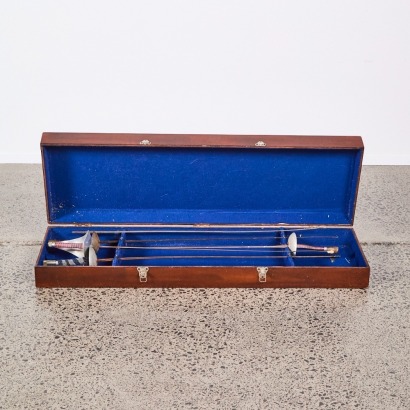 A Set of Four Fencing Swords in a Case