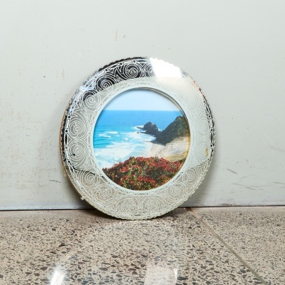 A Mid-Century Wall Mirror with Koru Design Border and Beach Scene