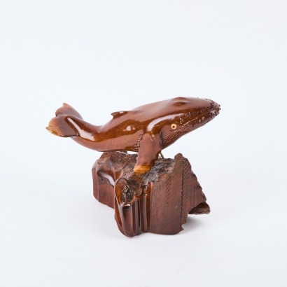 A Pitcairn Islands Hand-Carved Wooden Whale Signed by Paul Warren