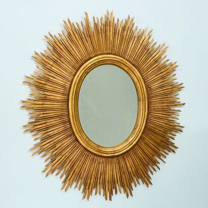 A Handmade Beveled Oval Sun Mirror in Gold Leaf