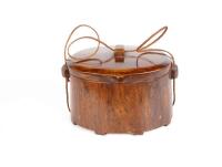 A Carved and Polished Oriental Hardwood (Teak) Oval Storage Box