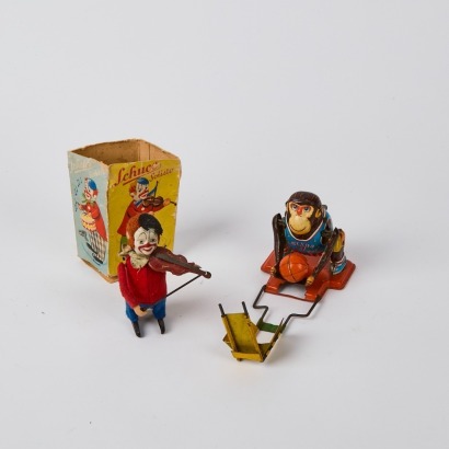 A Pair Of Vintage Tin Toys