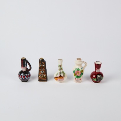 A Set of Five Drioli Cherry Wine Bottles