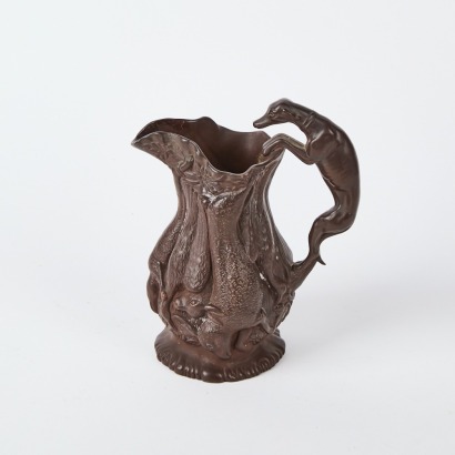 An Earthenware Hunting Jug with Raised Animal Detailing