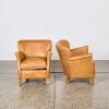 A Pair of Tan Stud Leather Professor Chairs by Timothy Oulton