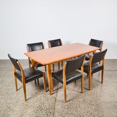 A Jon Jansen Mid Century Six Seater Mahogany Dining Table and Six Leather Dining Chairs