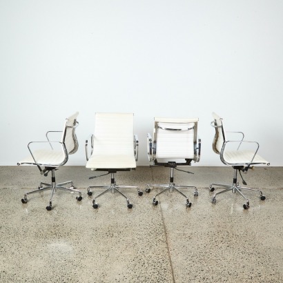 A Set of Four Replica Eames Moda Chairs