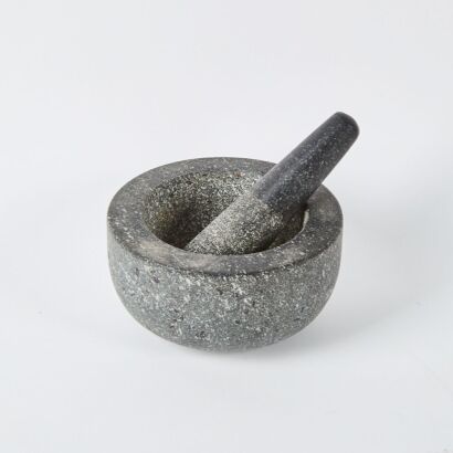 A Large Granite Mortar And Pestle