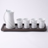 A Grancy Fu Porcelain Water Jug And Four Beakers With A Wooden Display Stand.