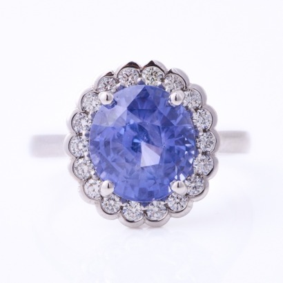 18ct White Gold, 6.21ct Blue Sapphire / .37ct total Diamond Halo Ring - Near new