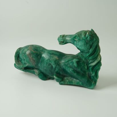 A Chinese 20th-Century Spinach Jade Recumbent Horse