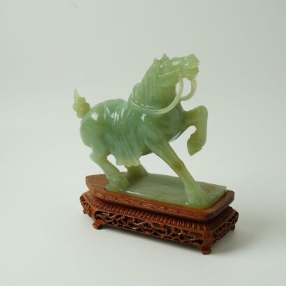 A Chinese 20th-Century Spinach Jade Standing Horse