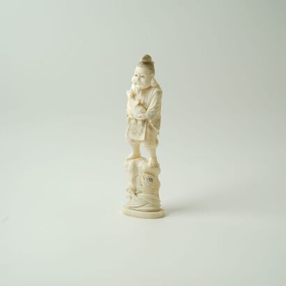 A Japanese Meiji-Period Carved Ivory Figure (Original Stand)