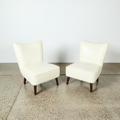 A Pair of White Retro Style Lounge Chairs
