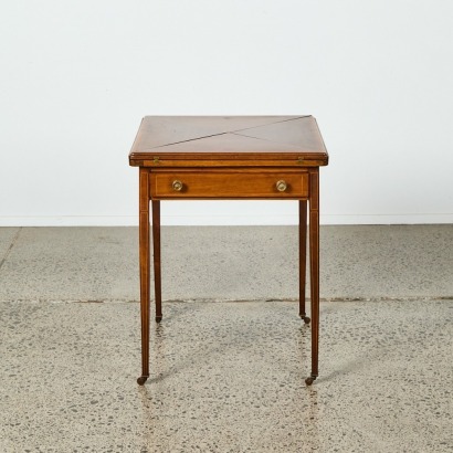 An Antique Edwardian Mahogany Envelope Card Table on Castors
