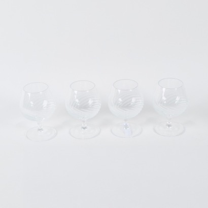 A Set Of Four Etched Crystal Brandy Snifter Glasses