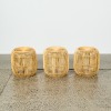 A Set of Three Rattan Stools