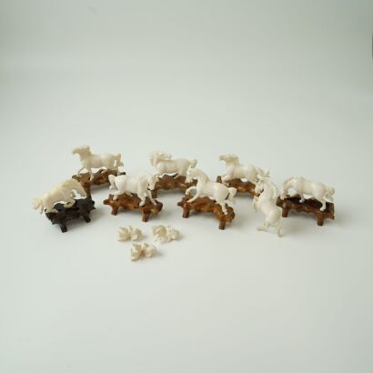 A Set of Eight Chinese Carved Ivory Horses and Three Fishes