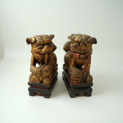 A Pair of Chinese Qing Dynasty Gilt Lacquer Wooden Lions