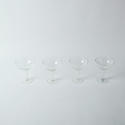 A Set of Four Vintage Hollow Stemmed Champagne Glasses