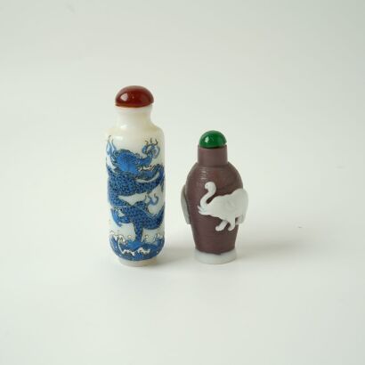 A Chinese Double-color Overlay Glass Snuff Bottle and a White Glass Blue-enamelled &lsquo;Dragon&rsquo; Snuff Bottle