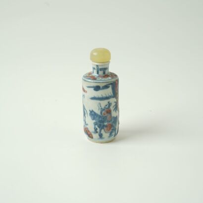 A Chinese Qing Dynasty underglaze-blue and copper-red &lsquo;Figural&rsquo; Snuff Bottle