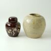 A Chinese Qing Dynasty Celadon-glazed Jar AND A Persimmon-glazed Carved Lidded Jar