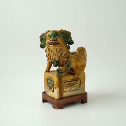 A Chinese Qing Dynasty Yellow and Green Glazed Lion Ornament