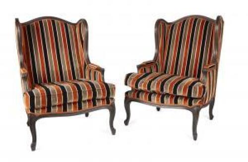 A Pair of Louis XV Style Wing Back Chairs with Ebonised Frames