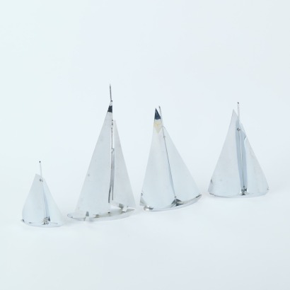 A Set of Four Chrome Yachts