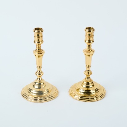 A Pair of Brass Baldwin Candle Holders
