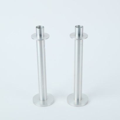 A Pair of Minimal Turned Aluminium Candle Holders