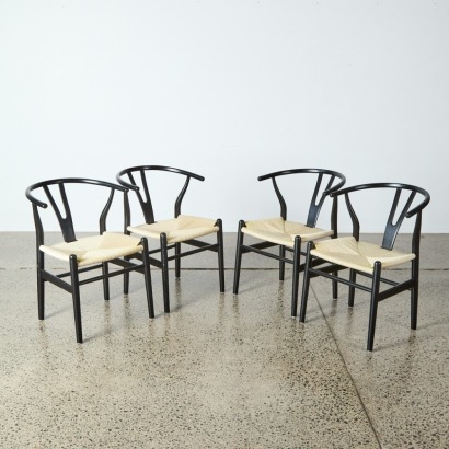 A Set of Four Black Wishbone Beech Y Replica Dining Chairs