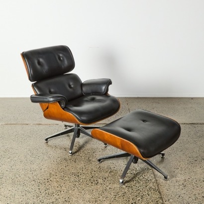 A Reproduction Eames Chair and Ottoman