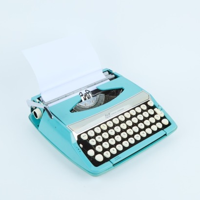 A Smith Corona Corsair Deluxe Portable Typewriter