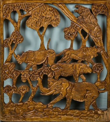 A Carved Wild Animal Wall Hanging