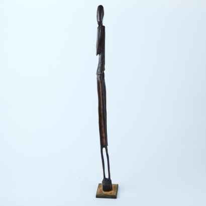 An Elongated Carved Figure