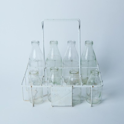 A Vintage Milk Crate And Bottles