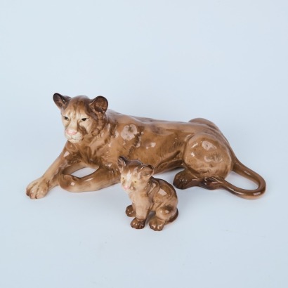 A Ceramic Lioness And Cub