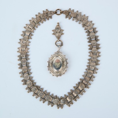 A Stamped Out Articulated Necklace And Brooch