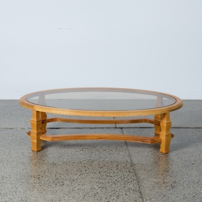 An Oval Solid Rimu Coffee Table With Glass Insert