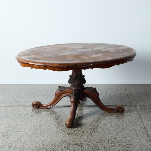 An Antique Burr Dining Table