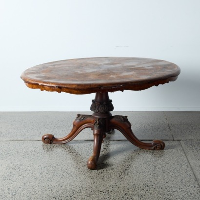 An Antique Burr Dining Table